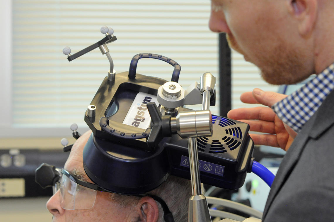 The device contains two magnetic coils that produce small electric currents. During treatment, the device makes a tapping sound and participants feel a light pressure inside the brain at the area being targeted.