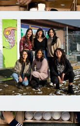 Photo of group of women and boxes of food donations