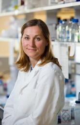 A woman in a white lab coat