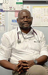 A man sits in a doctors office