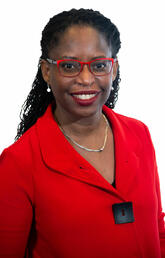 A woman in a red blazer