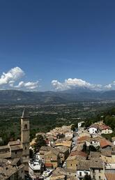 A mountaintop view of a village in Italy