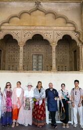 A group of people stand in front of temple