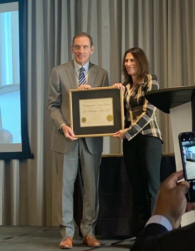 Lisa Silver accepting Markham Silver's award posthumously