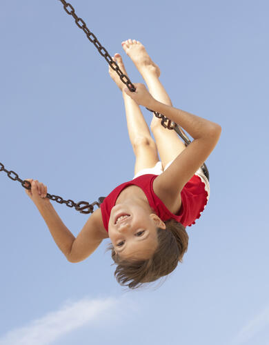 Smiling child on swing