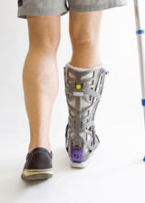 person with crutches